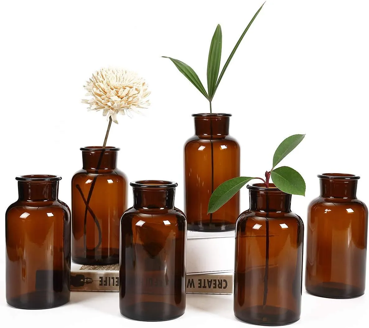 Pharmacist bottles with dried flower arrangement