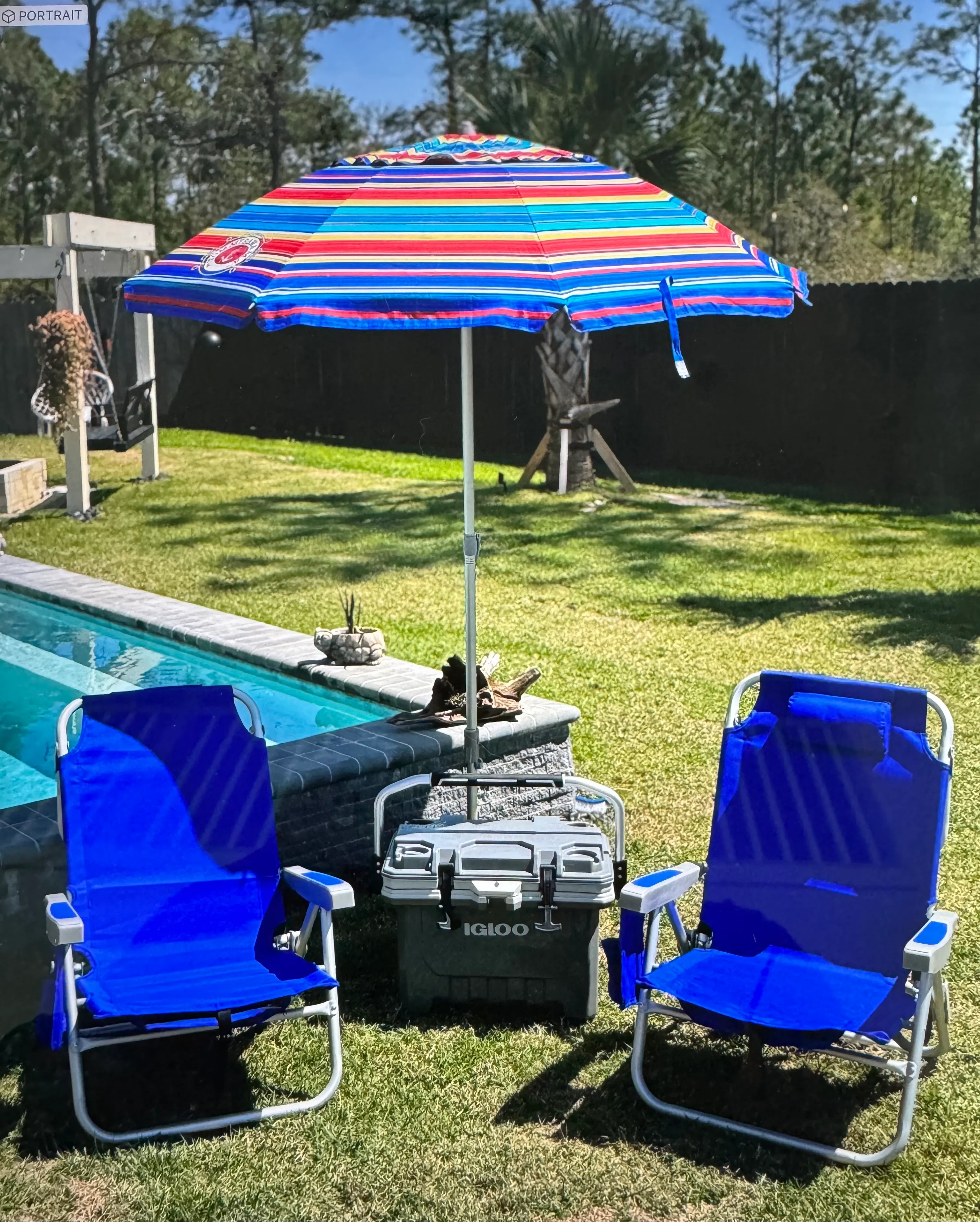 2 chairs, umbrella and medium cooler