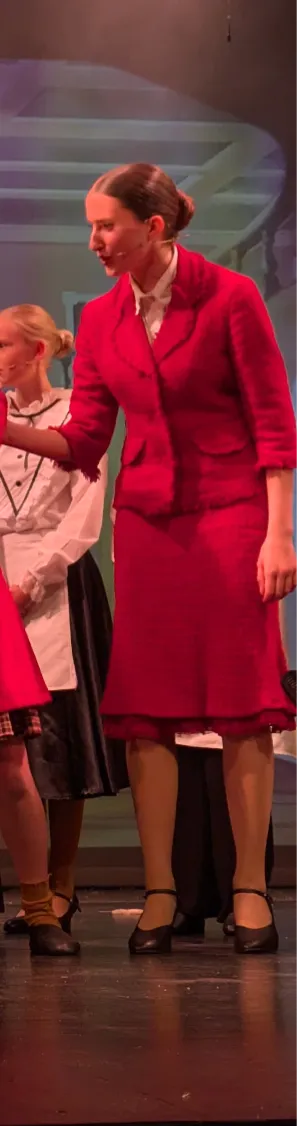 Red skirt suit and white blouse
