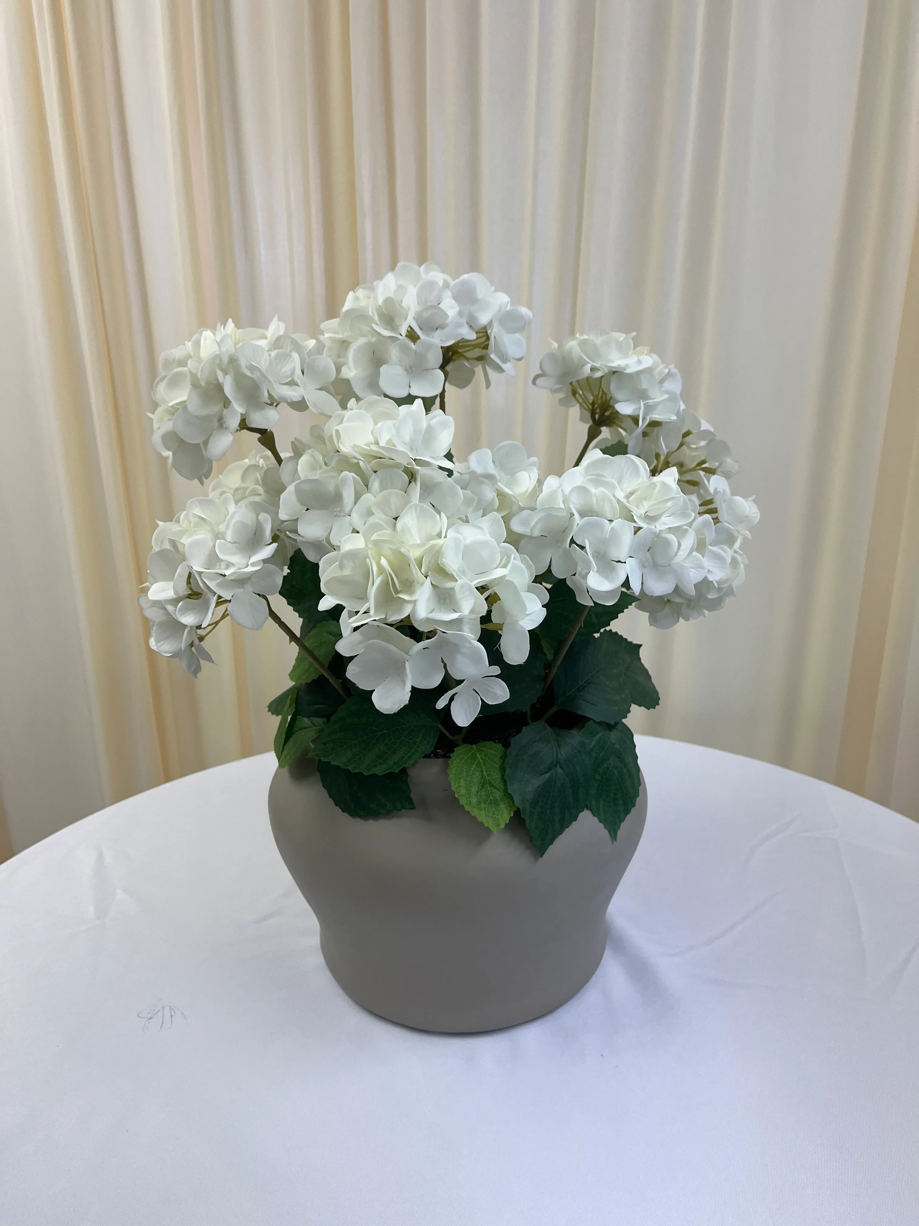 White Florals in Gray Ceramic Vase