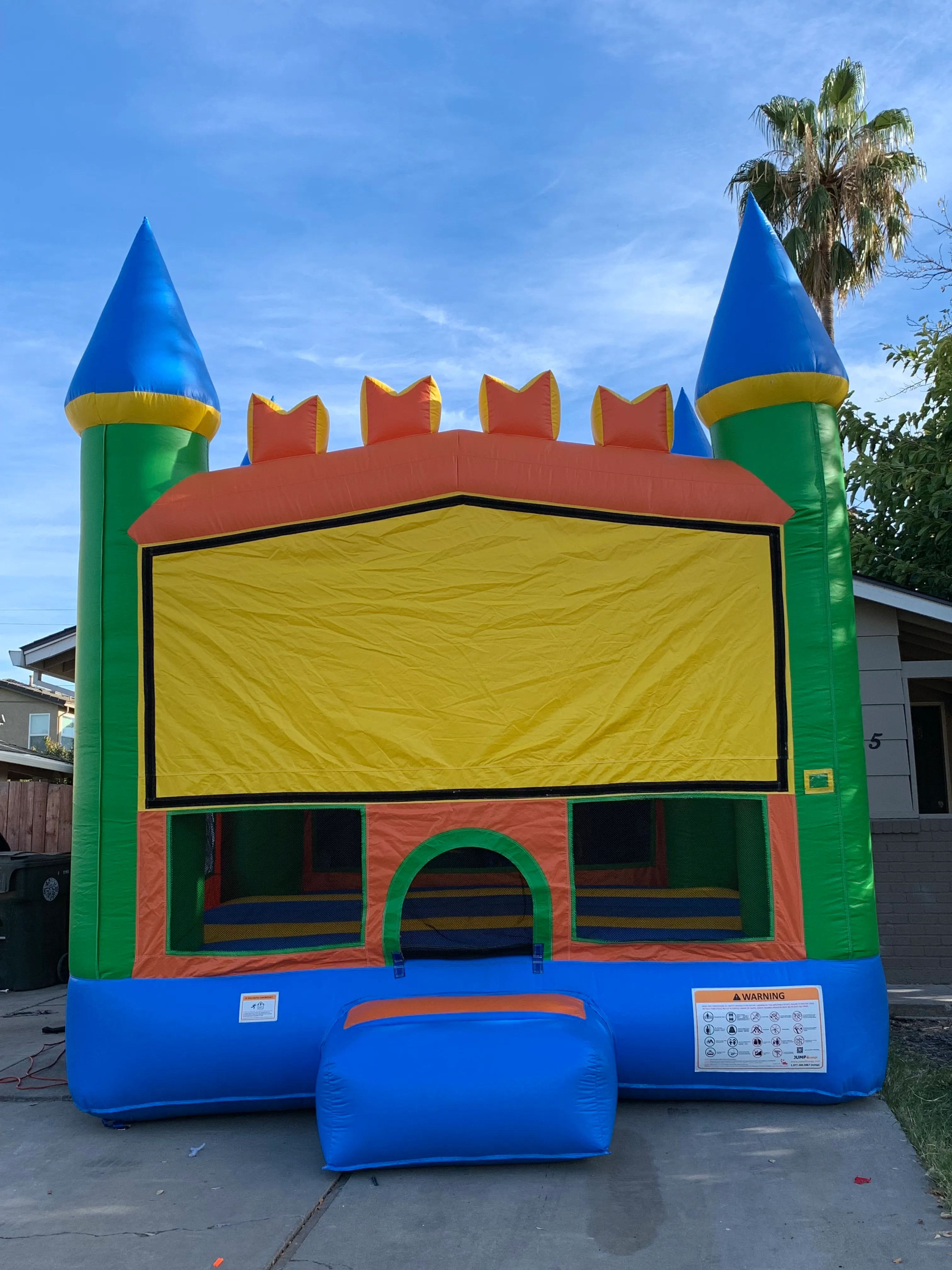 #62 Color castle bounce house with hoops 