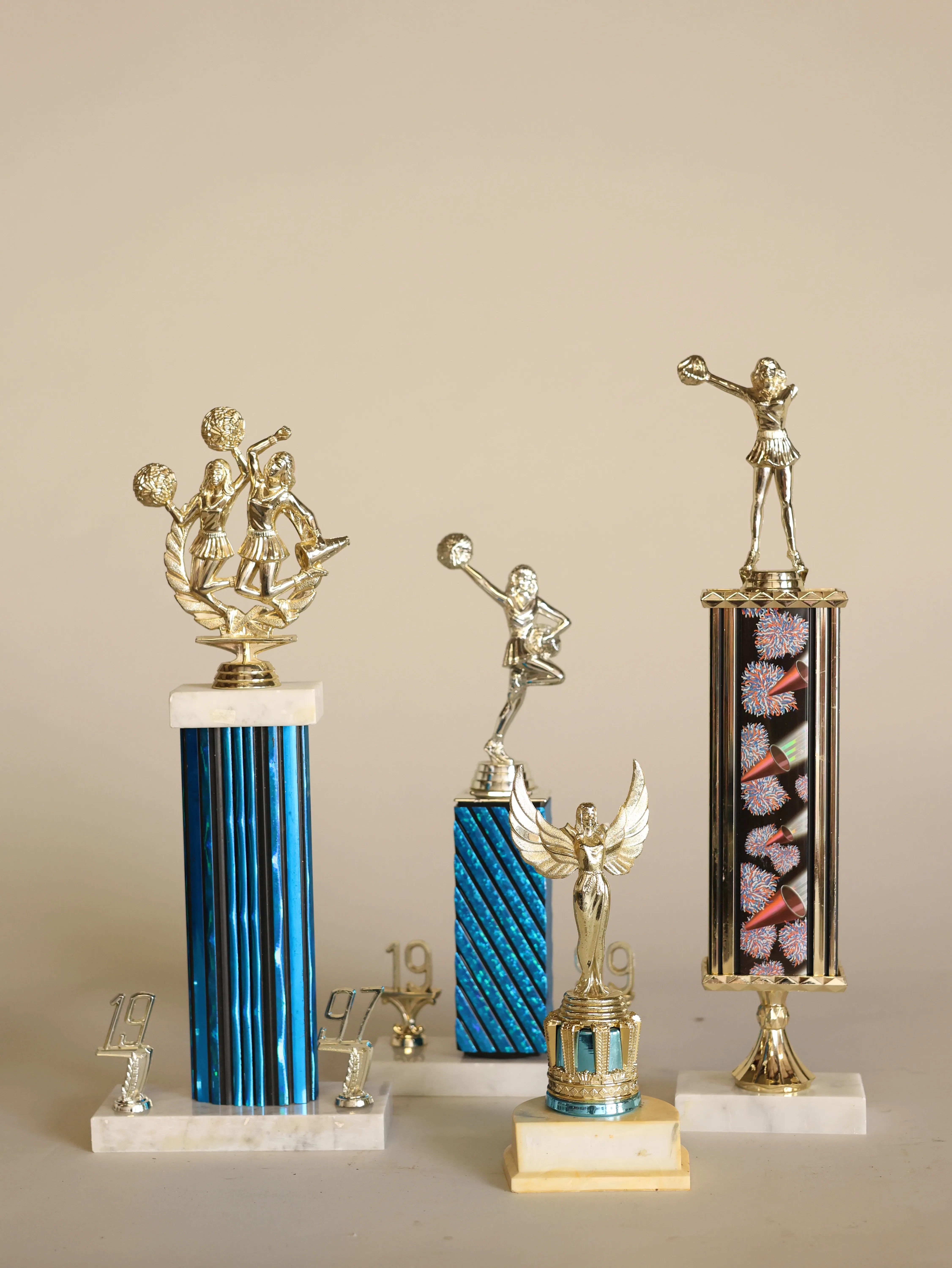Assorted cheerleaders trophies