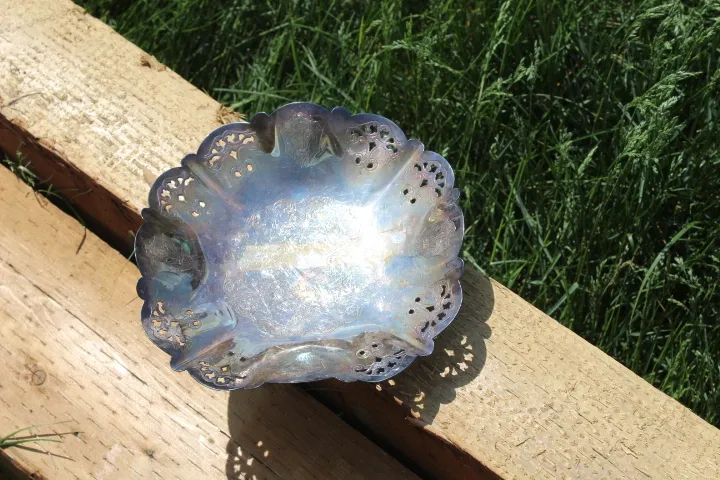 Tarnished silver plate with curved and cutout edge