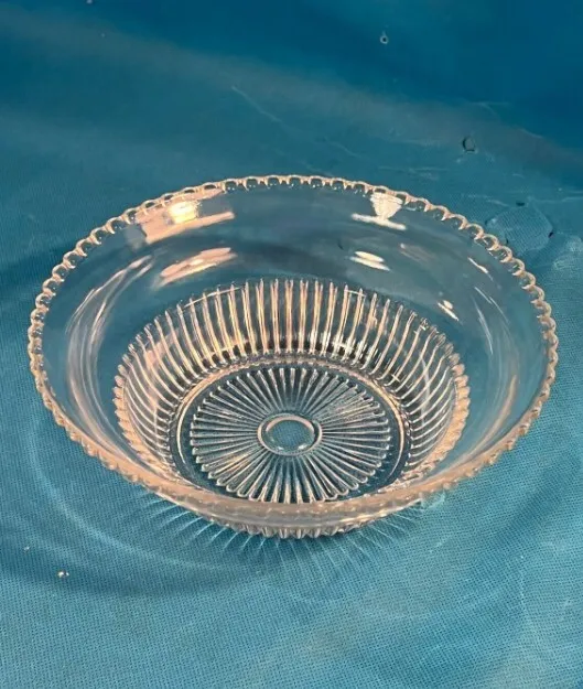 Vintage clear ribbed glass serving bowl with beaded rim