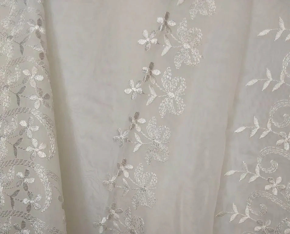 Champagne sheer fabric with rows of daisies tied with ribbons  - email us directly if you wish to rent this product