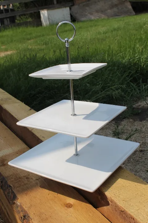3 tiered white ceramic treat stand with stainless steel handle