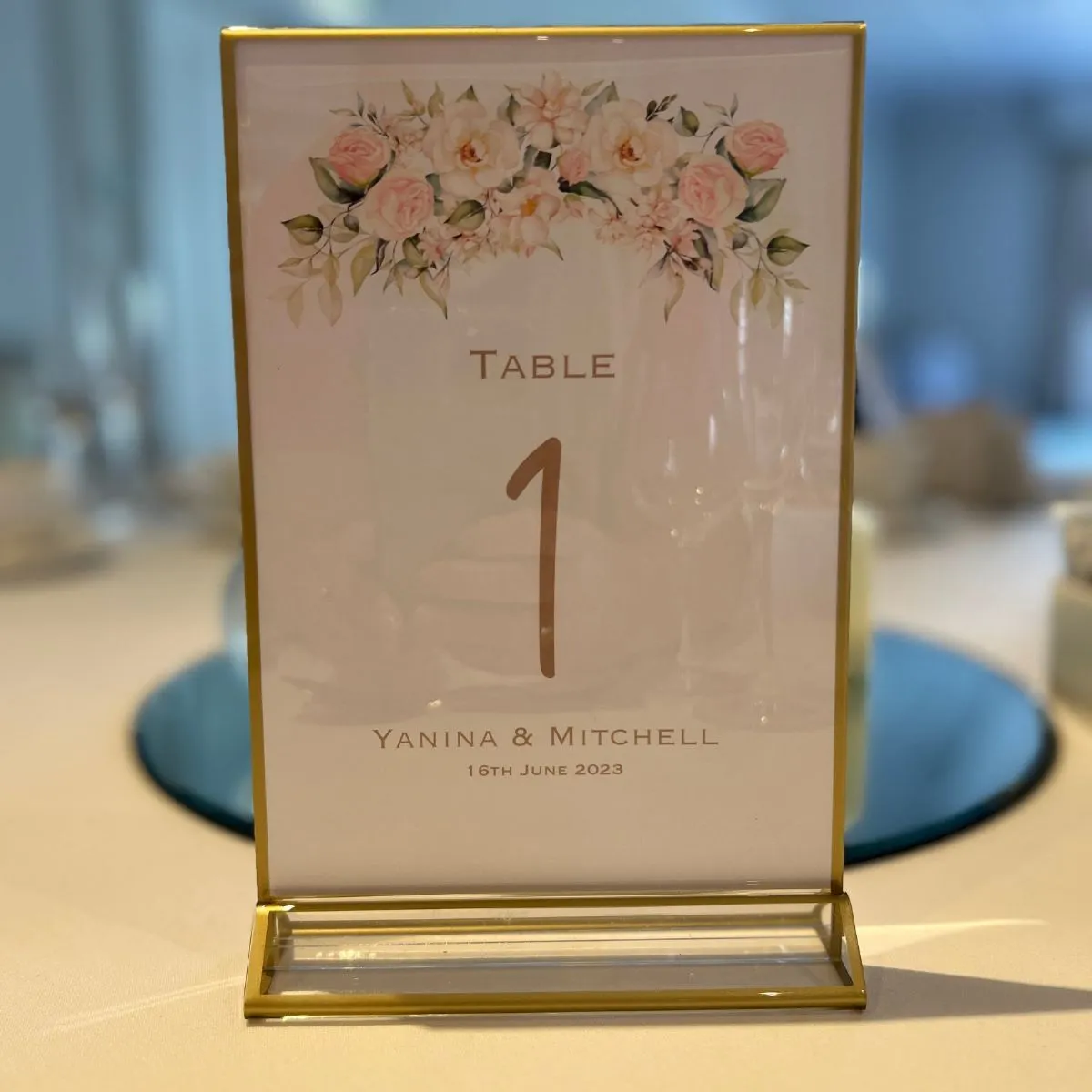 Gold rimmed personalised table numbers